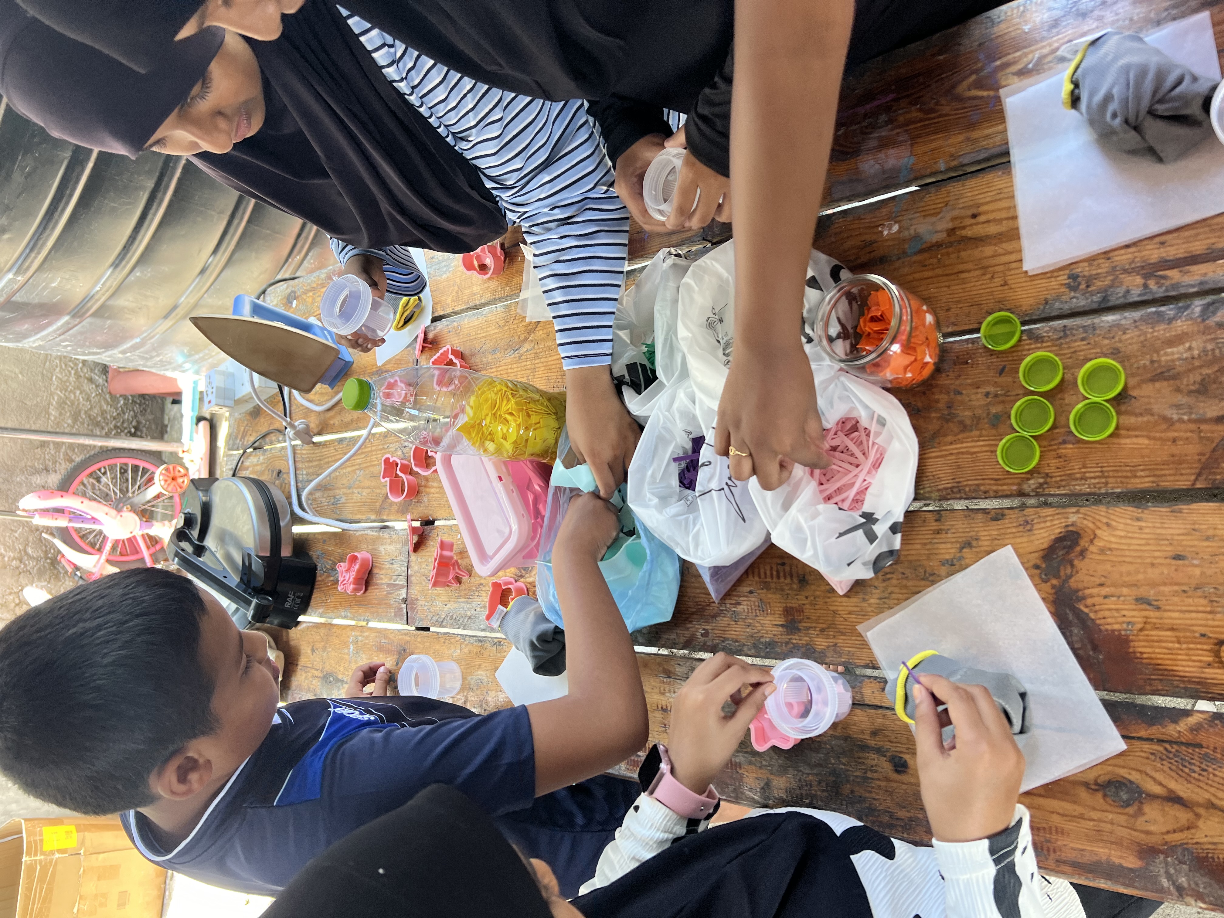 Children participating in a plastic sorting workshop